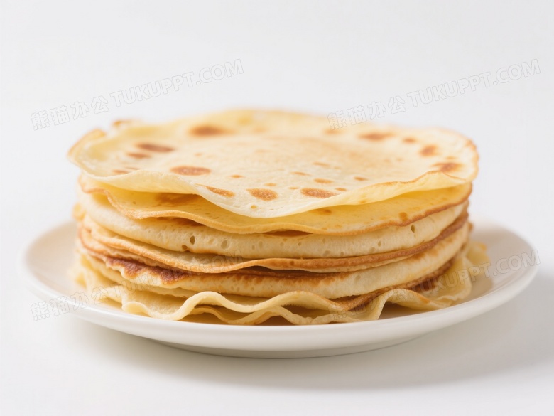金黄可丽饼堆叠瓷盘柔光图片