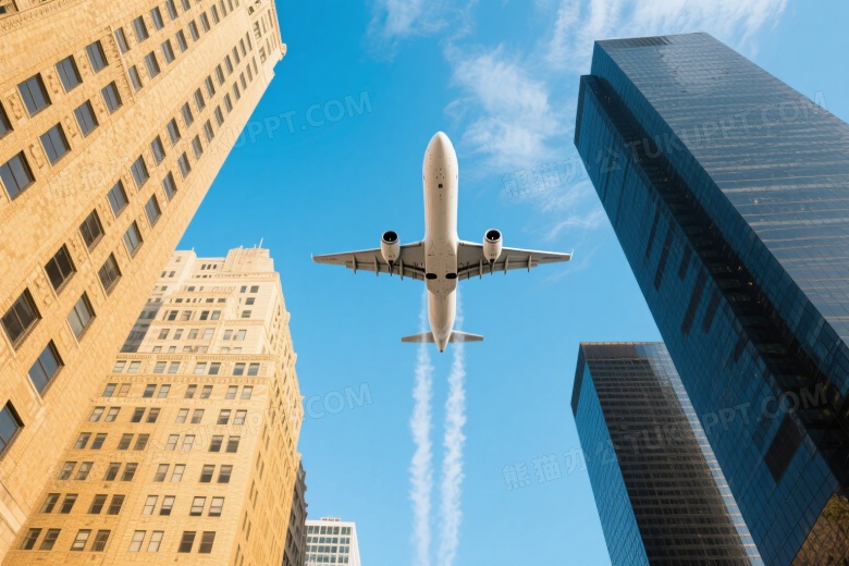 白色客机低空飞越城市建筑仰拍图片