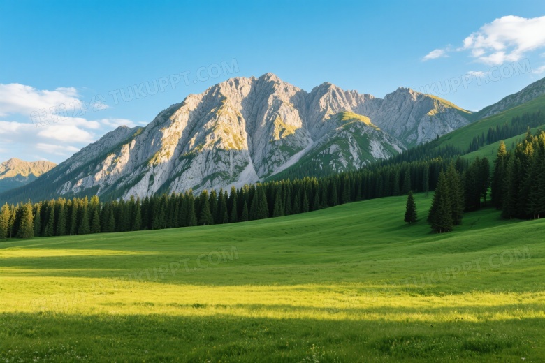 翠绿草甸与岩壁山峰侧逆光图片