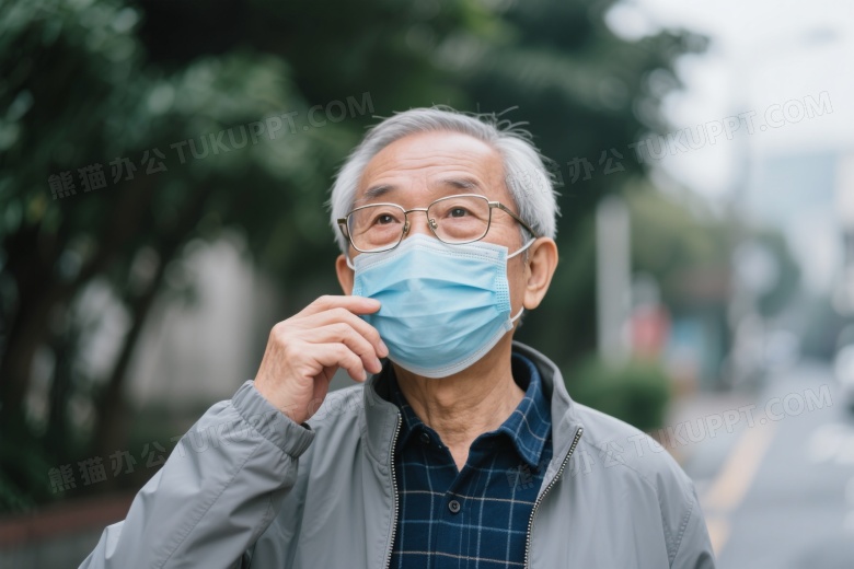 老年男性戴口罩望向右上方图片