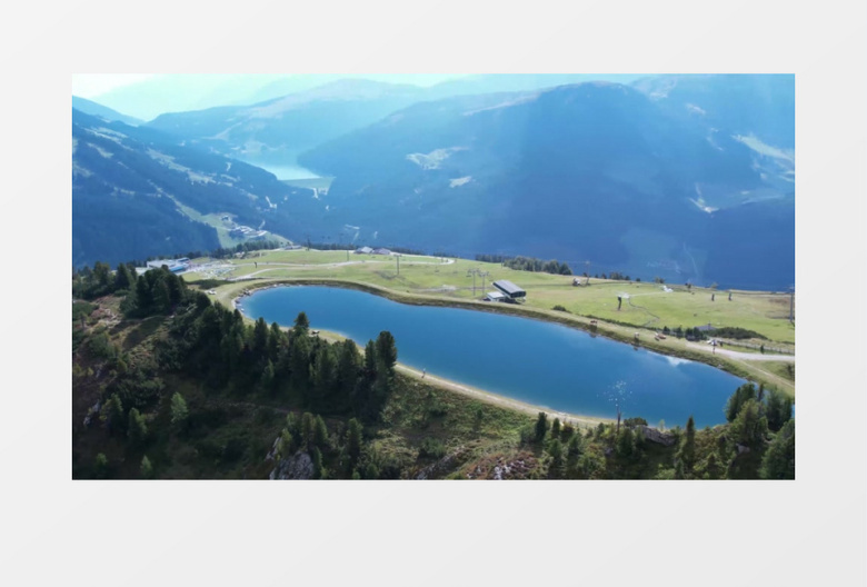 航拍山顶上的湖水和山丘风光实拍视频素材