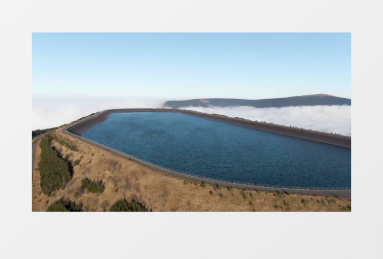 航拍山顶的湖泊和环湖公路实拍视频素材